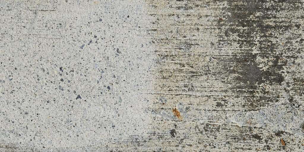 Soda blasting smoke damage from concrete surface during fire restoration